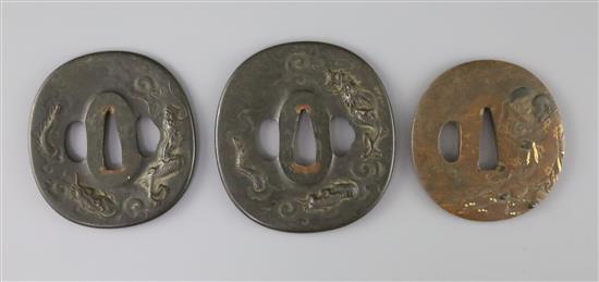 A set of Japanese daisho tsuba and a bronze and mixed metal tsuba, 19th century, 7cm (3)